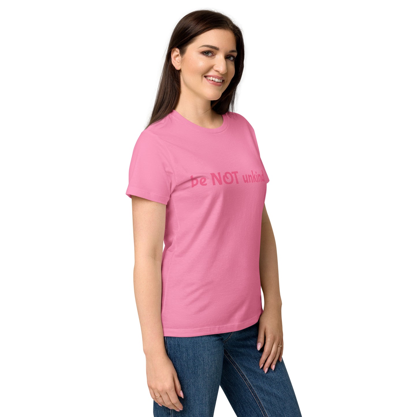 Woman wearing a pink t-shirt with colorful graphic and white background