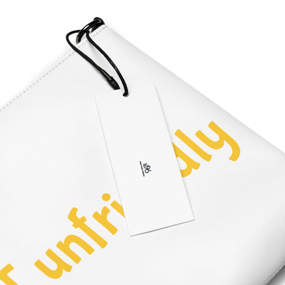 White pouch with yellow text 'be not unfriendly' and a black drawstring on a white background