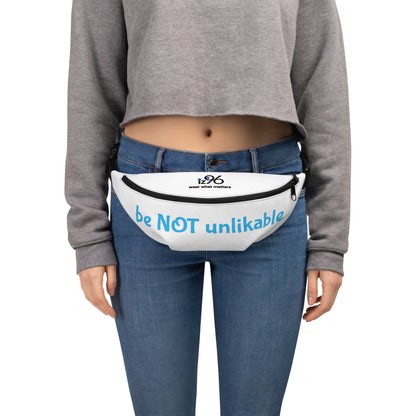 Person wearing a patterned fanny pack on a white background