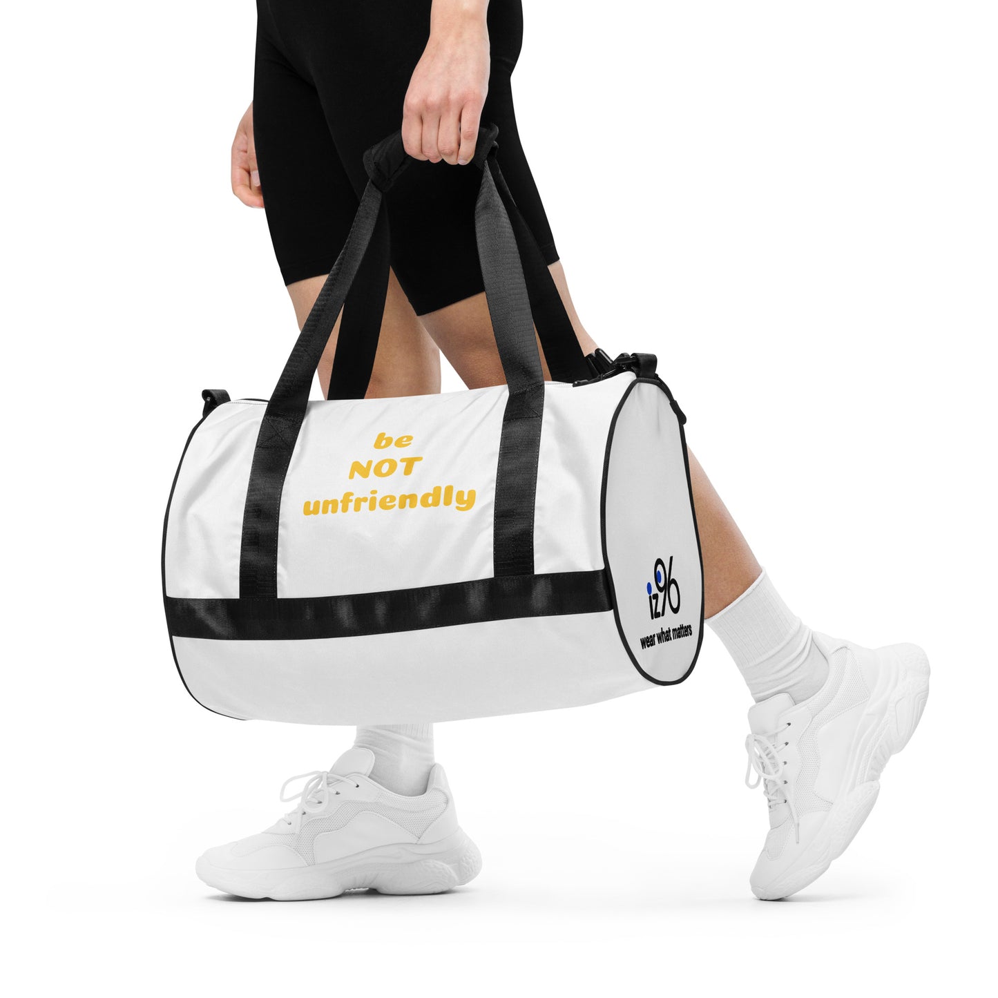 Person holding a white duffel bag with 'be not unfriendly' text on a white background