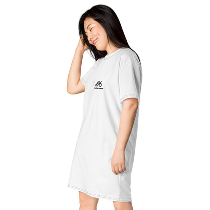 Woman wearing a white t-shirt dress on a white background