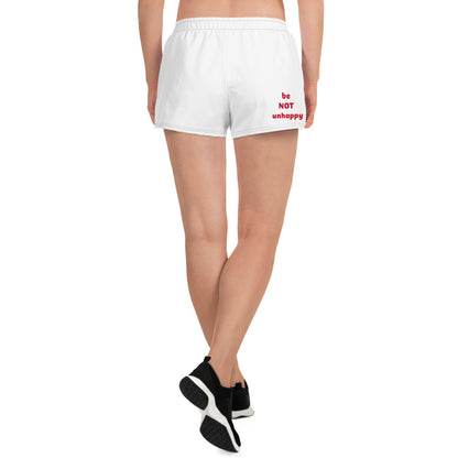 White shorts with 'be NOT unhappy' text on a white background
