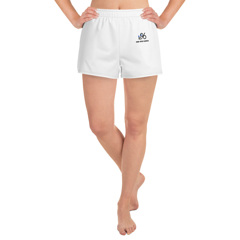 White shorts with a small logo worn by a person on a white background
