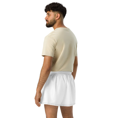Man wearing a beige t-shirt and white shorts on a white background