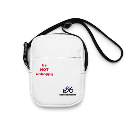 White crossbody bag with 'be NOT unkind' text and iz96 logo on a white background