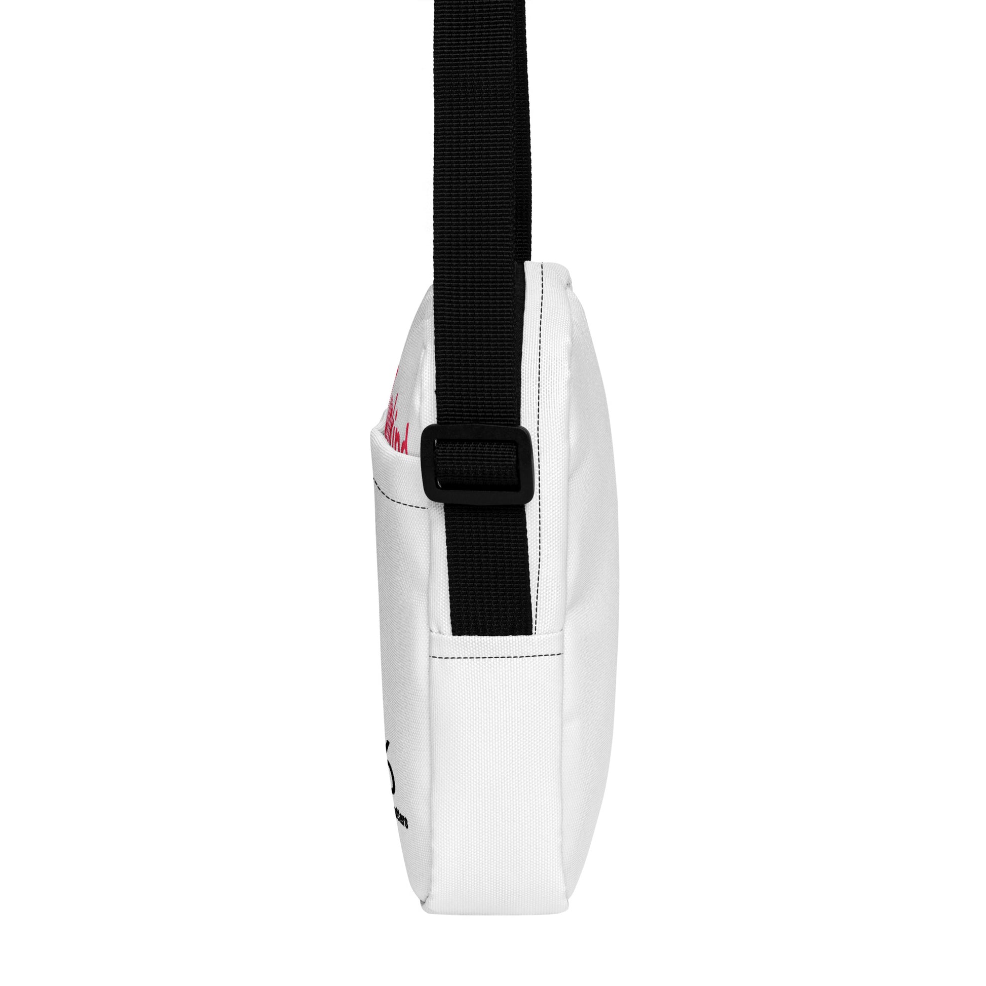 White crossbody bag with a black strap on a white background