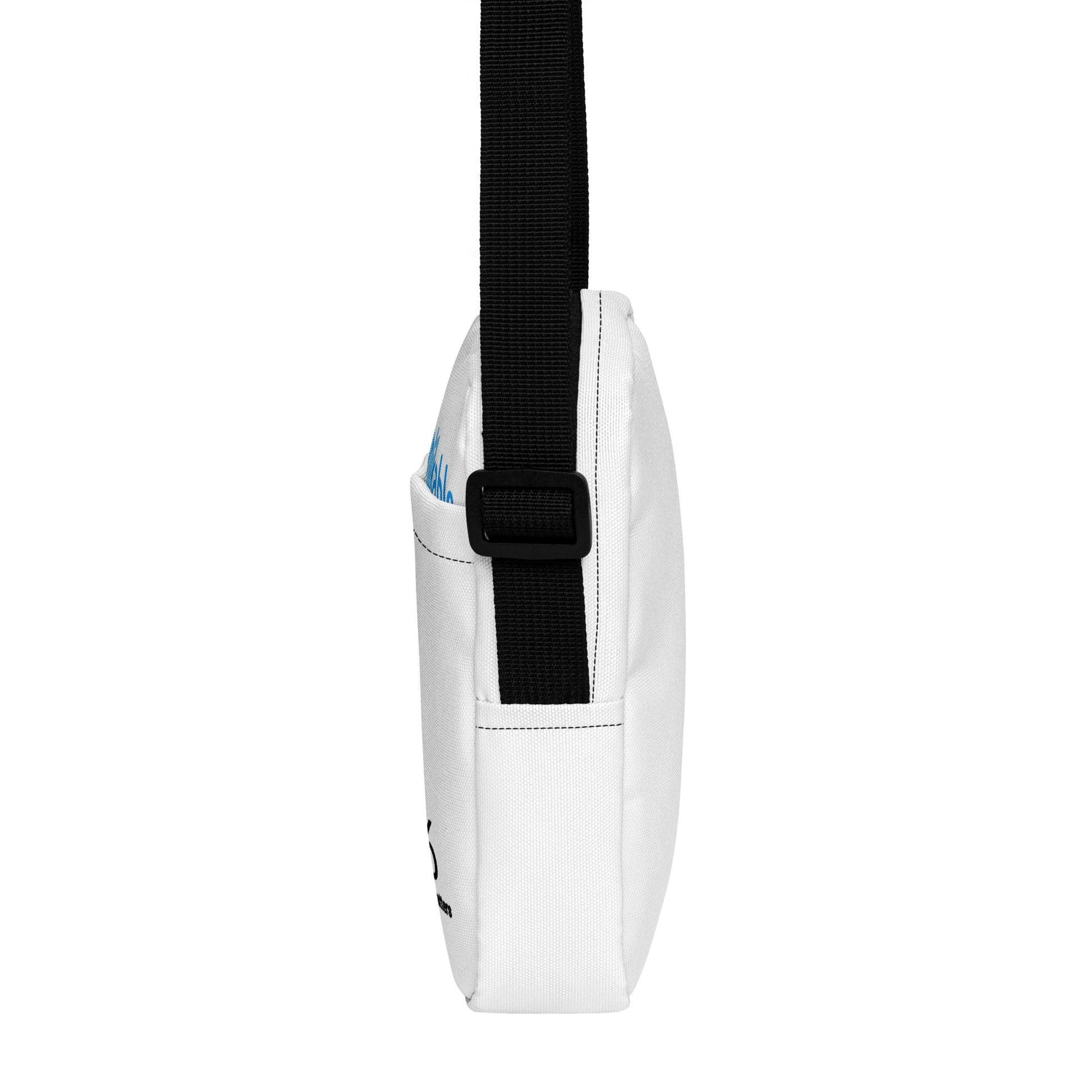 White crossbody bag with a black strap on a white background