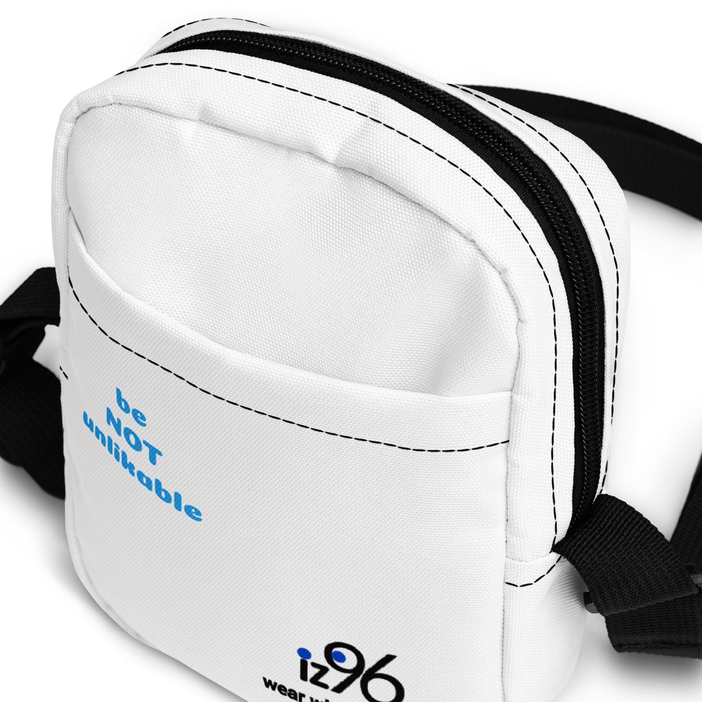White waist bag with black strap and blue text on a white background