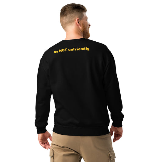Man wearing a black sweatshirt with 'be NOT unfriendly' text on the back, standing against a white background.