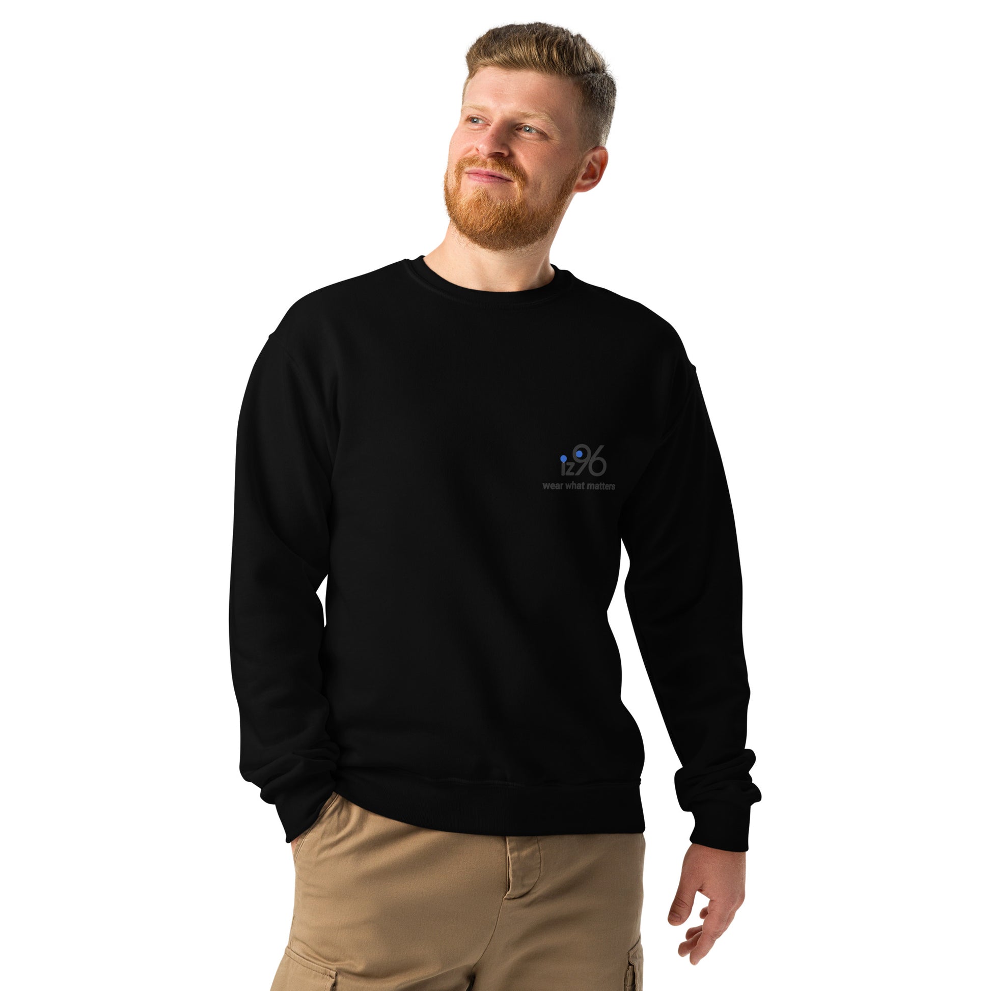 Man wearing a black sweatshirt with a logo on a white background