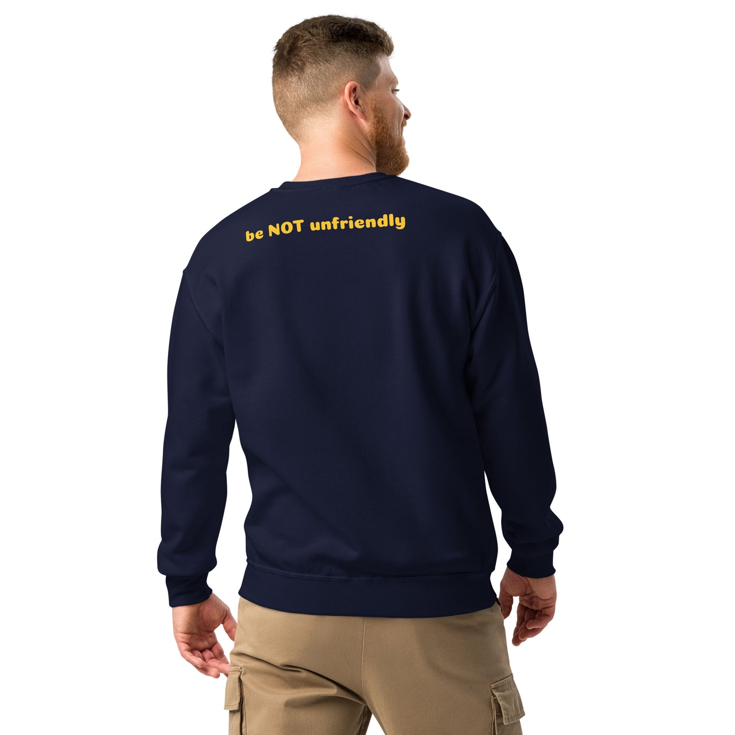 Man wearing a navy sweatshirt with 'be NOT unfriendly' text on the back, standing against a white background.