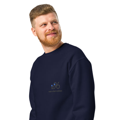 Man wearing a black sweatshirt with a logo on a white background