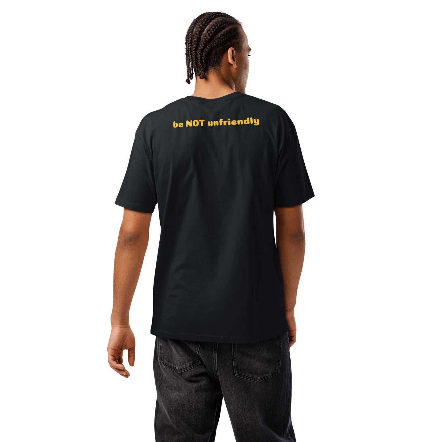 Person wearing a black t-shirt with yellow text on the back, standing against a white background