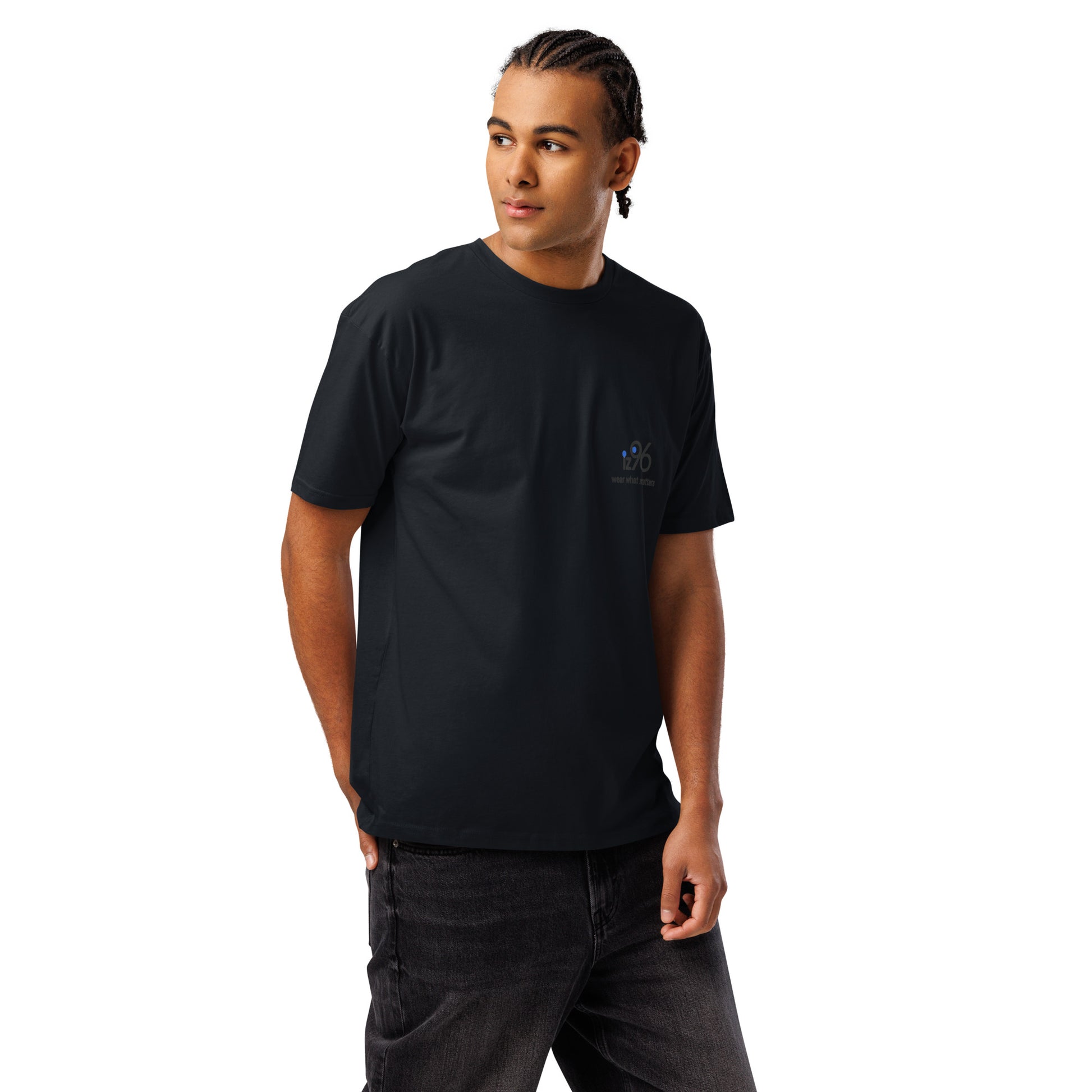 Person wearing a black t-shirt with logo design and text on a white background