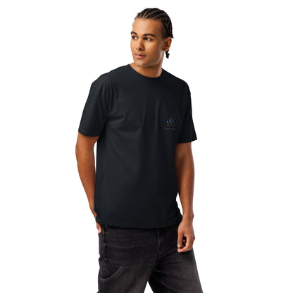 Person wearing a black t-shirt with logo design and text on a white background