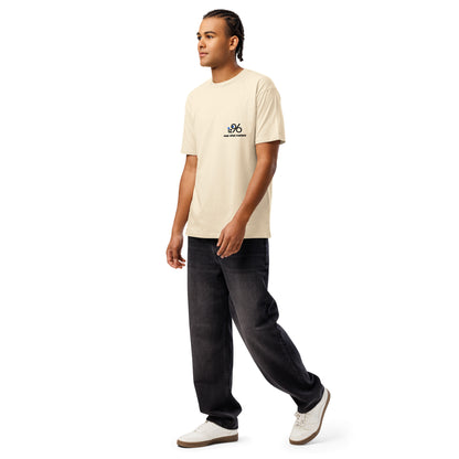 Person wearing a vintage white t-shirt with a logo on a white background