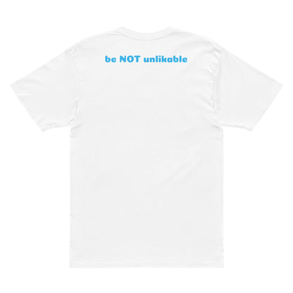 White t-shirt with blue text 'be NOT unlikable' on a white background