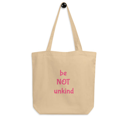 Beige tote bag with 'be NOT unkind' text in pink on a white background