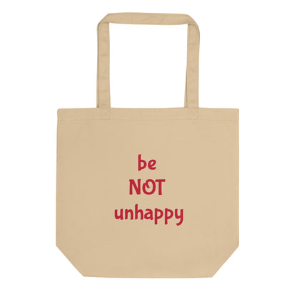Beige tote bag with red text 'be NOT unhappy' on a white background