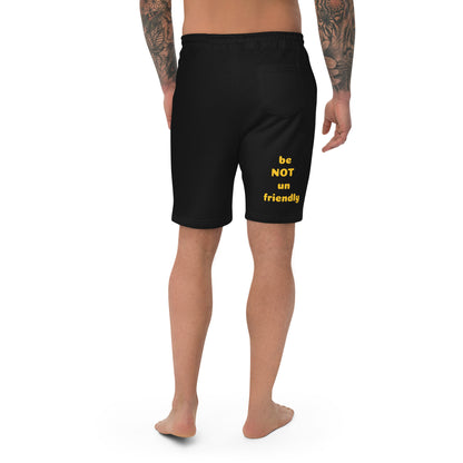 Black shorts with yellow text on a white background