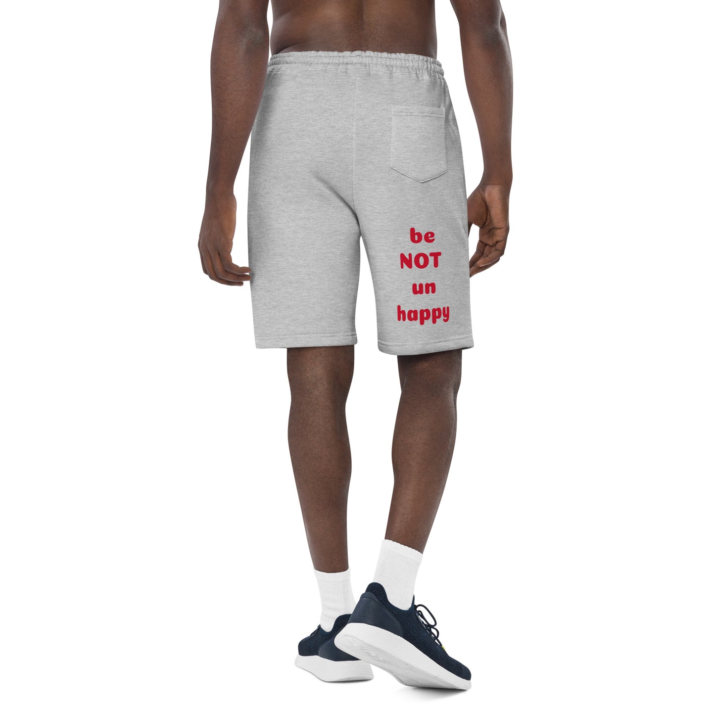 Person wearing gray shorts with red text on a white background