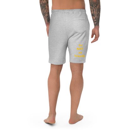 Person wearing gray shorts with yellow text on a white background