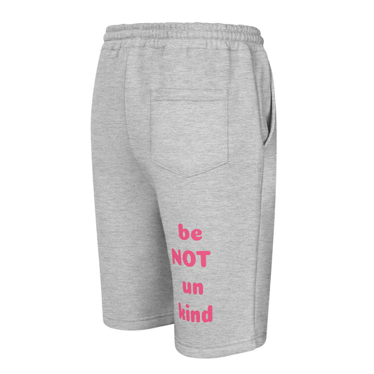 Gray shorts with pink text 'be NOT un kind' on a white background