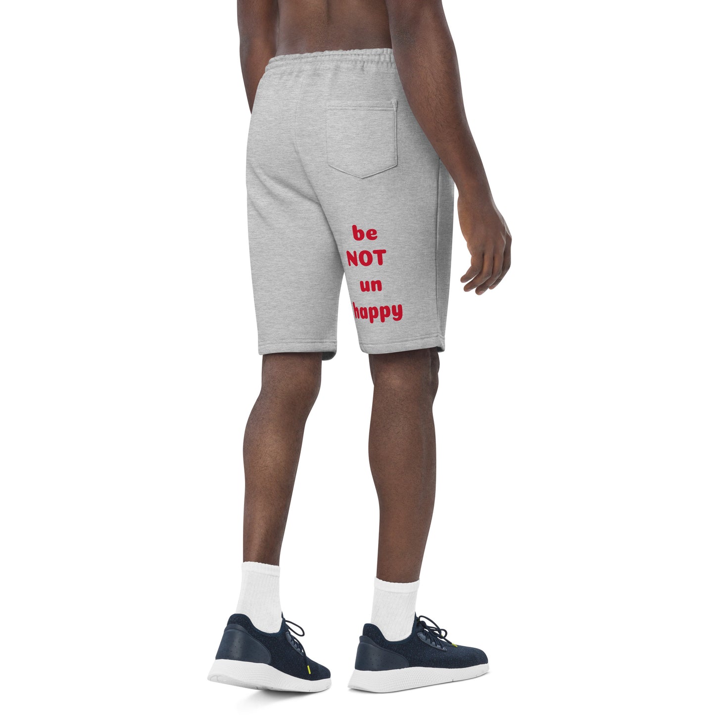 Person wearing gray shorts with red text on a white background