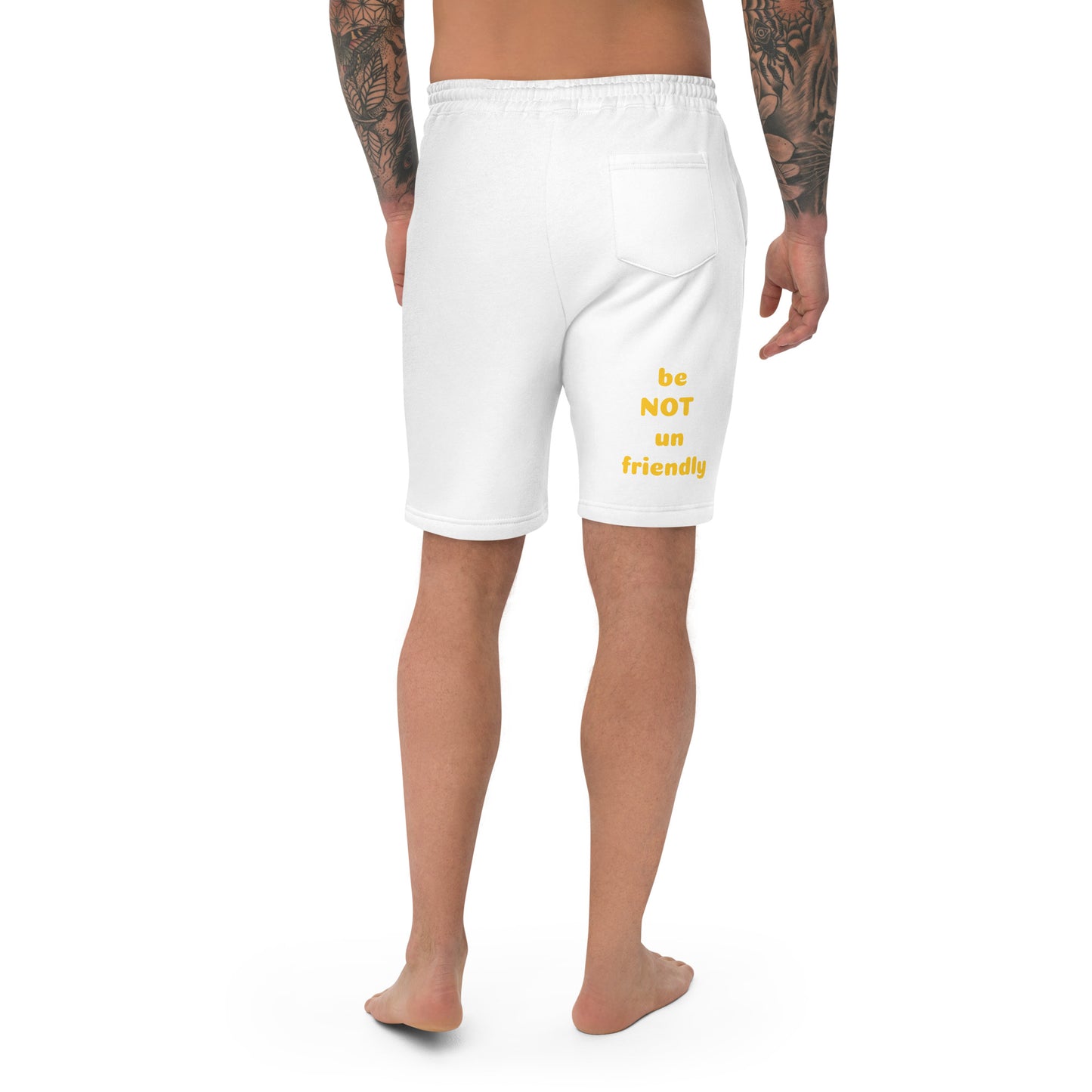 White shorts with yellow text worn by a person on a white background