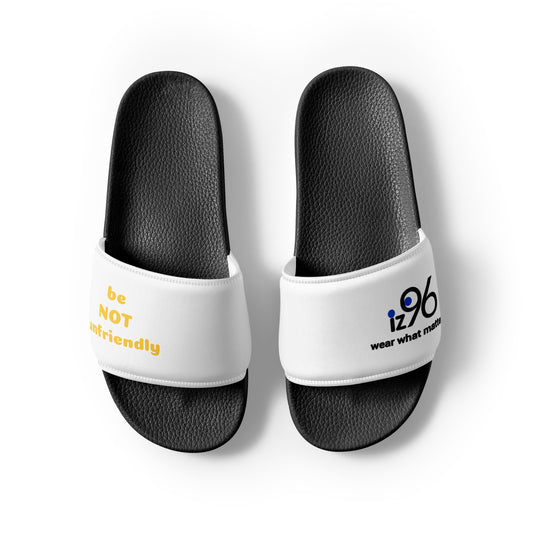White slides with black soles featuring text and a logo on a white background