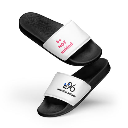 Black slides with white straps featuring text on a white background