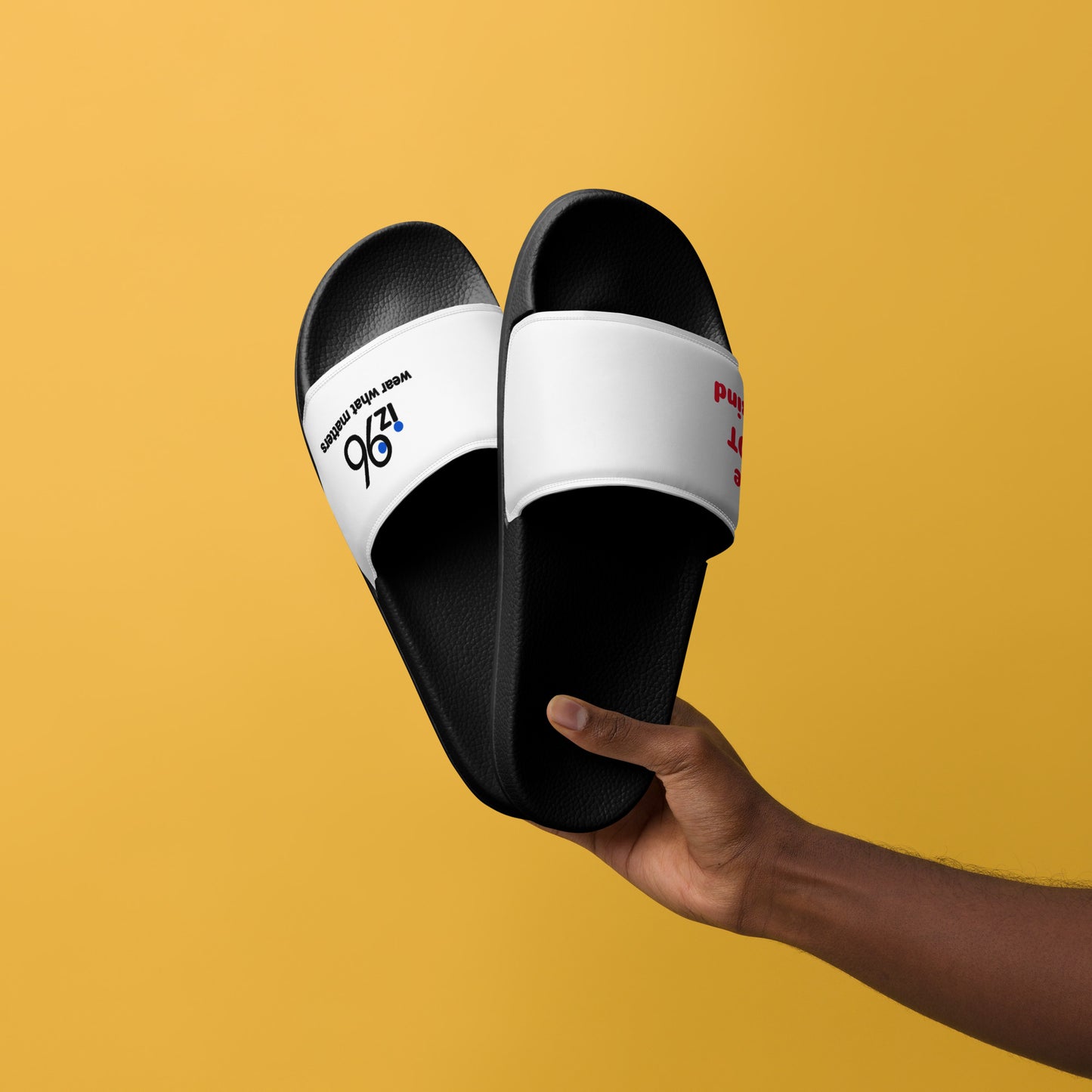 Black and white slides held by a hand against a yellow background