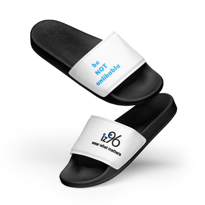 Black slides with white straps featuring text and a logo on a white background