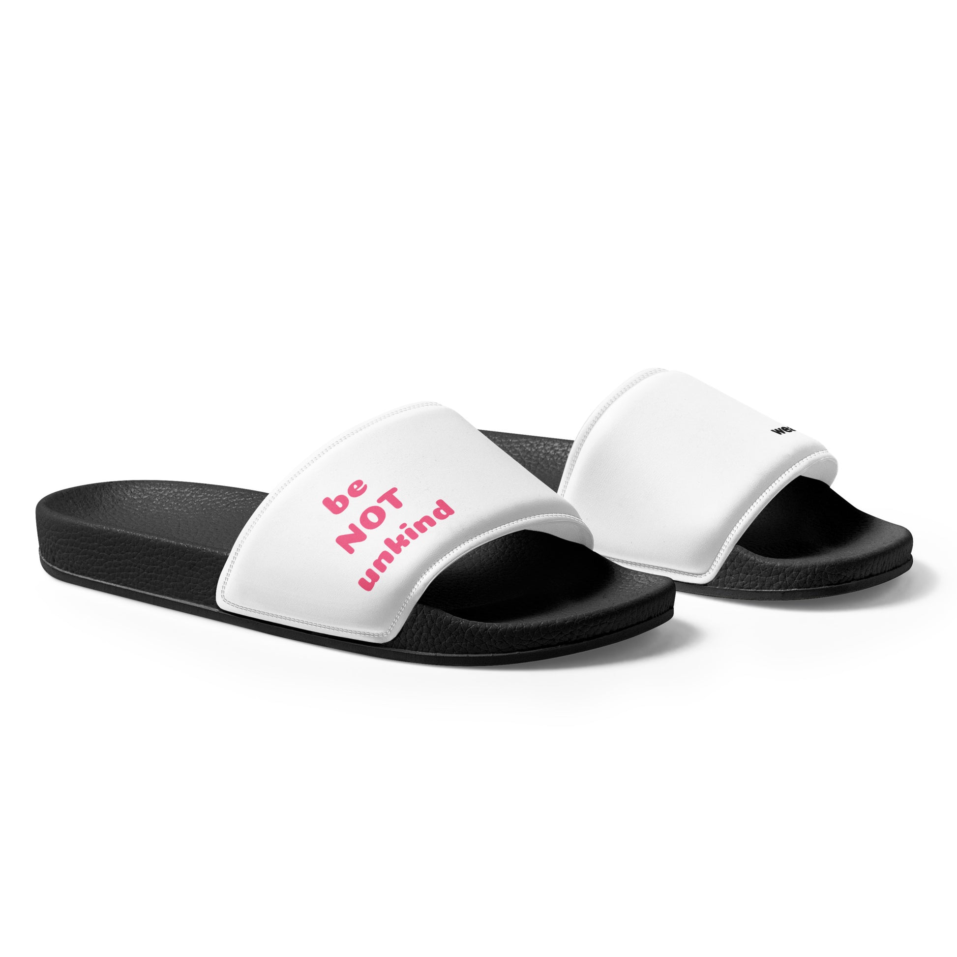 White slides with black soles and pink text on a white background