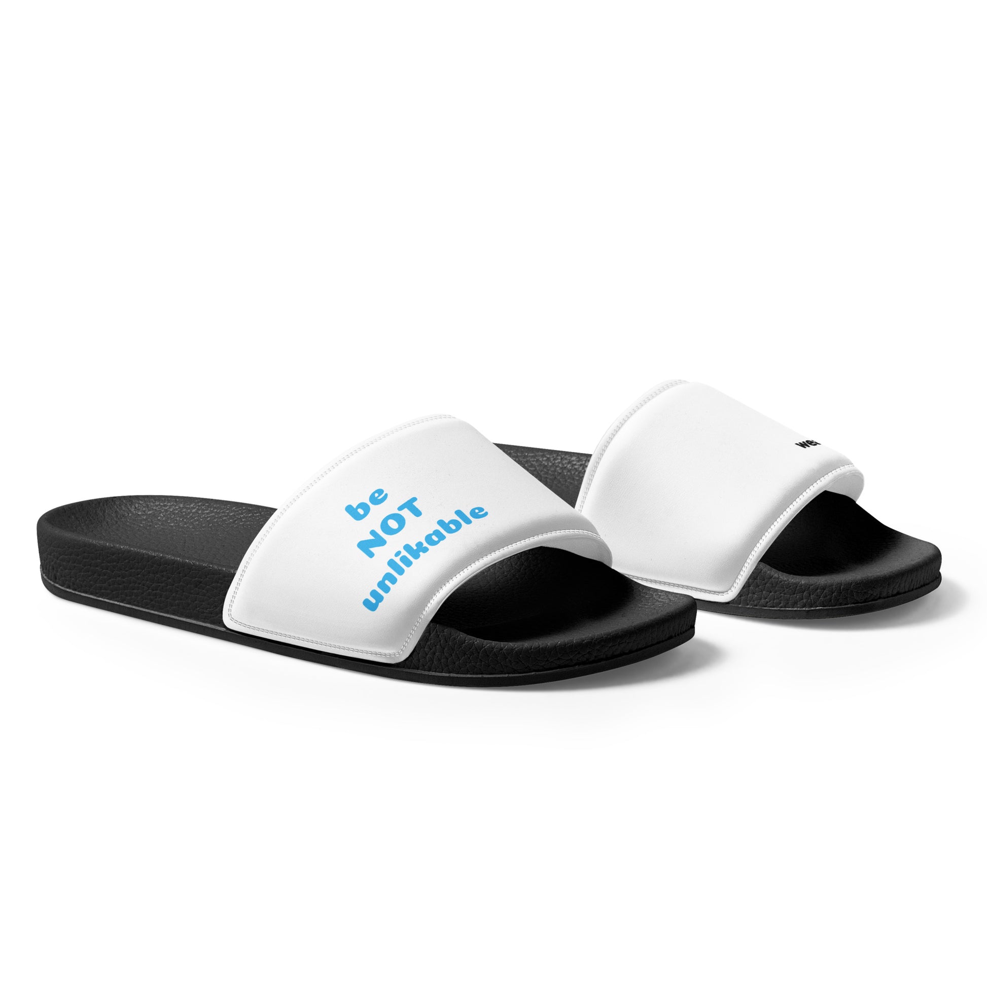 White slides with black soles and blue text 'be not unlikable' on a white background
