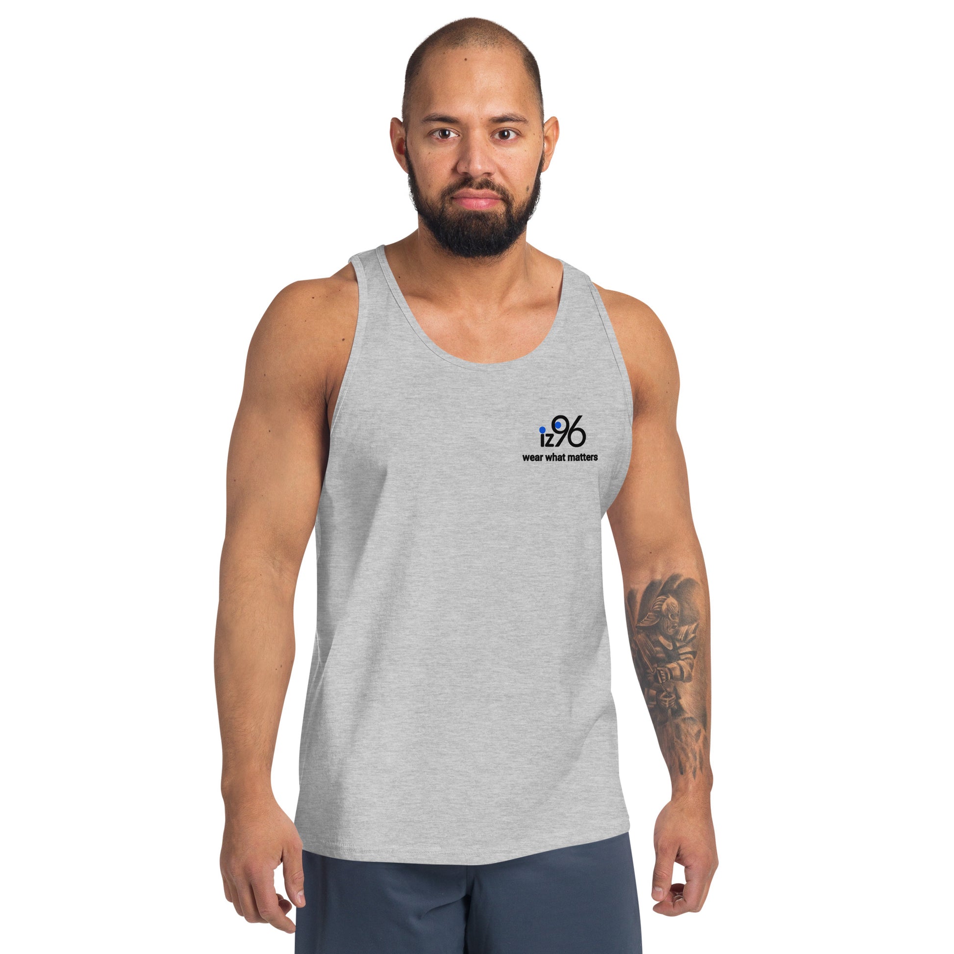 Man wearing a gray tank top with a small logo on a white background