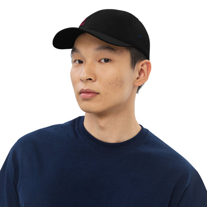 Person wearing a black cap with white text on a white background