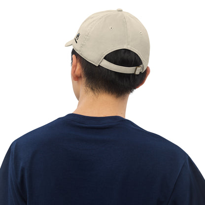 Person wearing a beige cap from behind on a white background