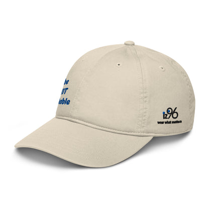 Beige cap with blue and black text on a white background
