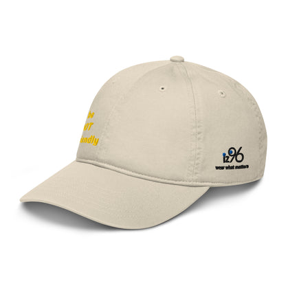 Beige cap with yellow text and black logo on a white background