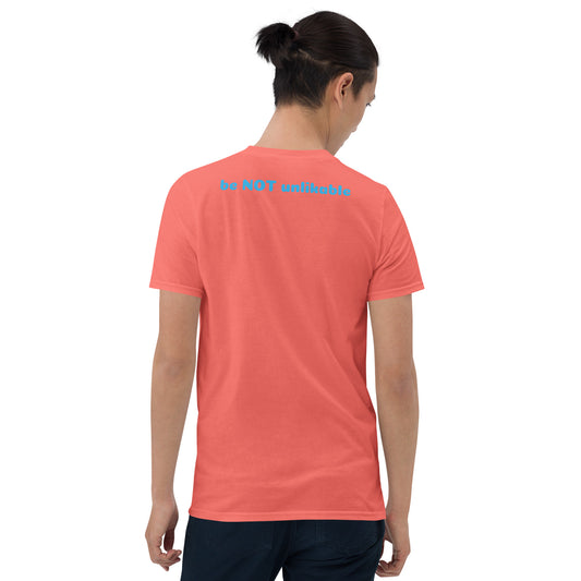 Person wearing a peach t-shirt with text on the back, standing against a white background