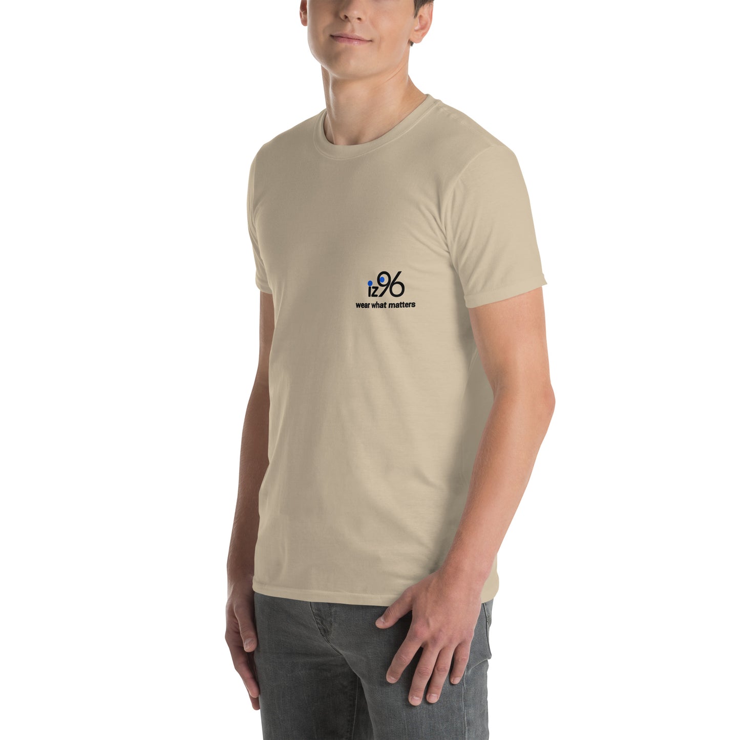 Person wearing a beige t-shirt with a logo on a white background