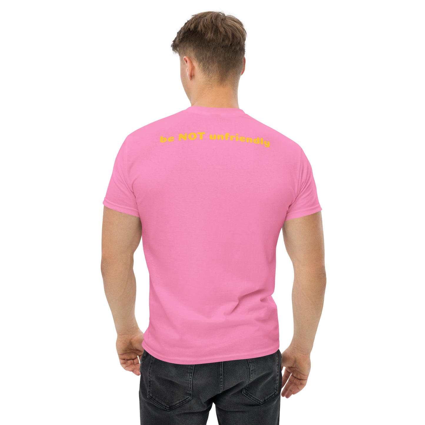 Person wearing a pink t-shirt with text on the back, standing against a white background