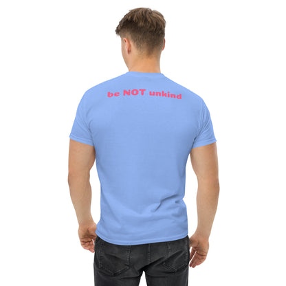 Man wearing a light blue t-shirt with a text on the back, standing against a white background