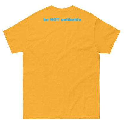 Yellow gold t-shirt with text 'be NOT unlikable' on the back against a white background