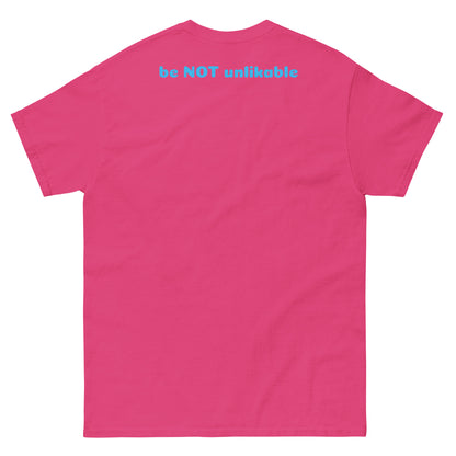 Pink t-shirt with text 'be NOT unlikable' on the back against a white background