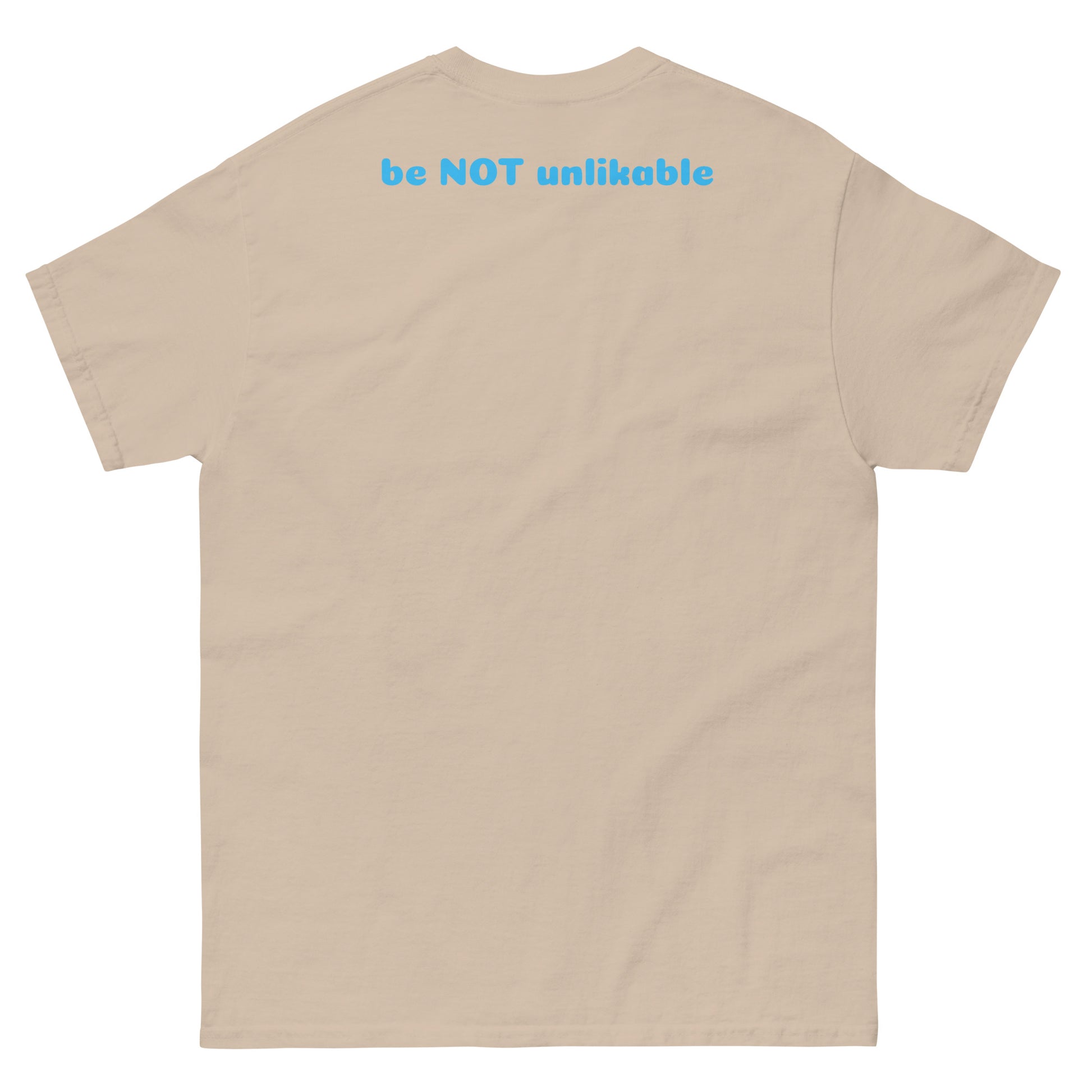 sand t-shirt with 'be NOT unlikable' text on the back against a white background