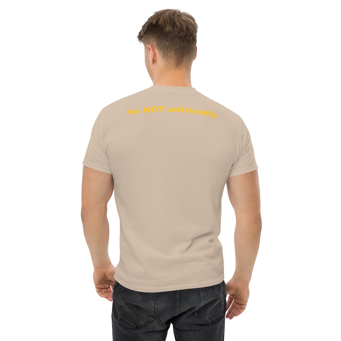 Man wearing a beige t-shirt with text on the back, standing against a white background