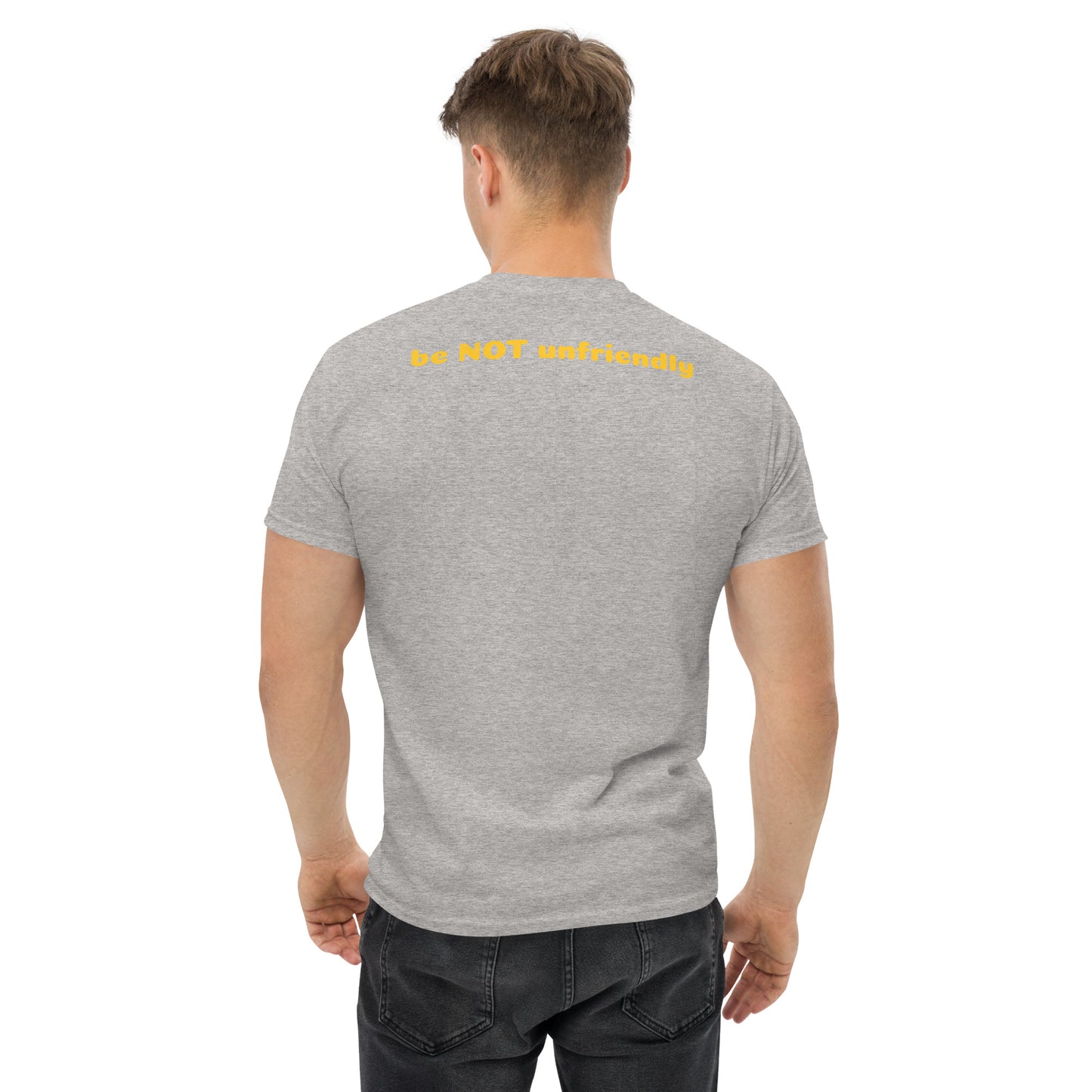 Man wearing a gray t-shirt with yellow text on the back, standing against a white background