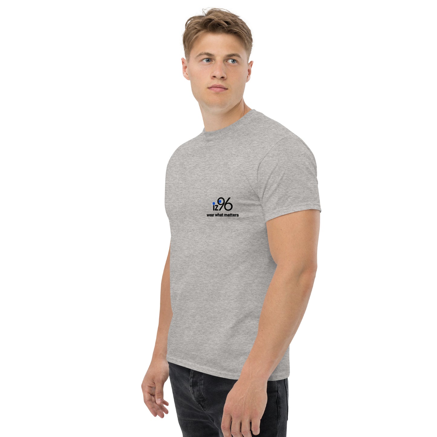 Man wearing a gray t-shirt with a logo on a white background